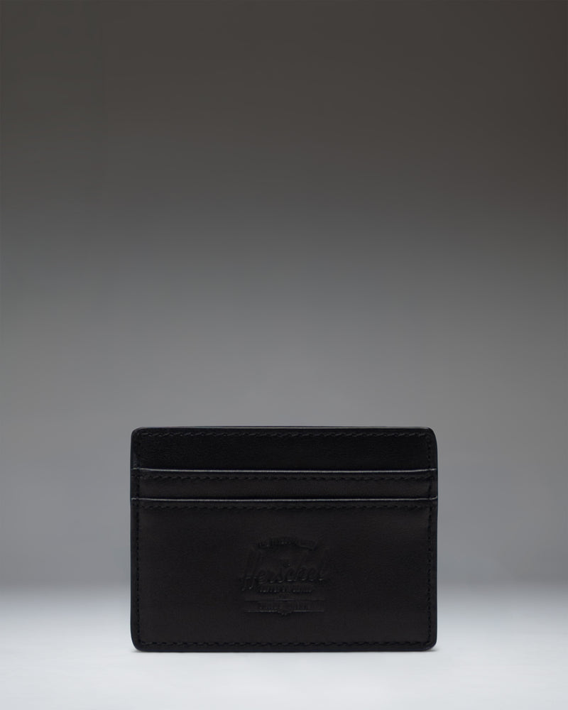 Herschel Supply Co. Charlie Cardholder Leather in Black, showcasing a slim design with multiple card slots and classic logo detail.