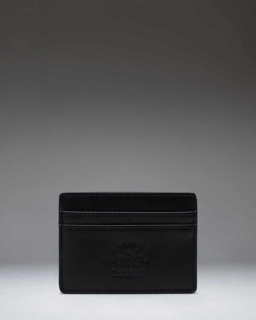 Herschel Supply Co. Charlie Cardholder Leather in Black, showcasing a slim design with multiple card slots and classic logo detail.