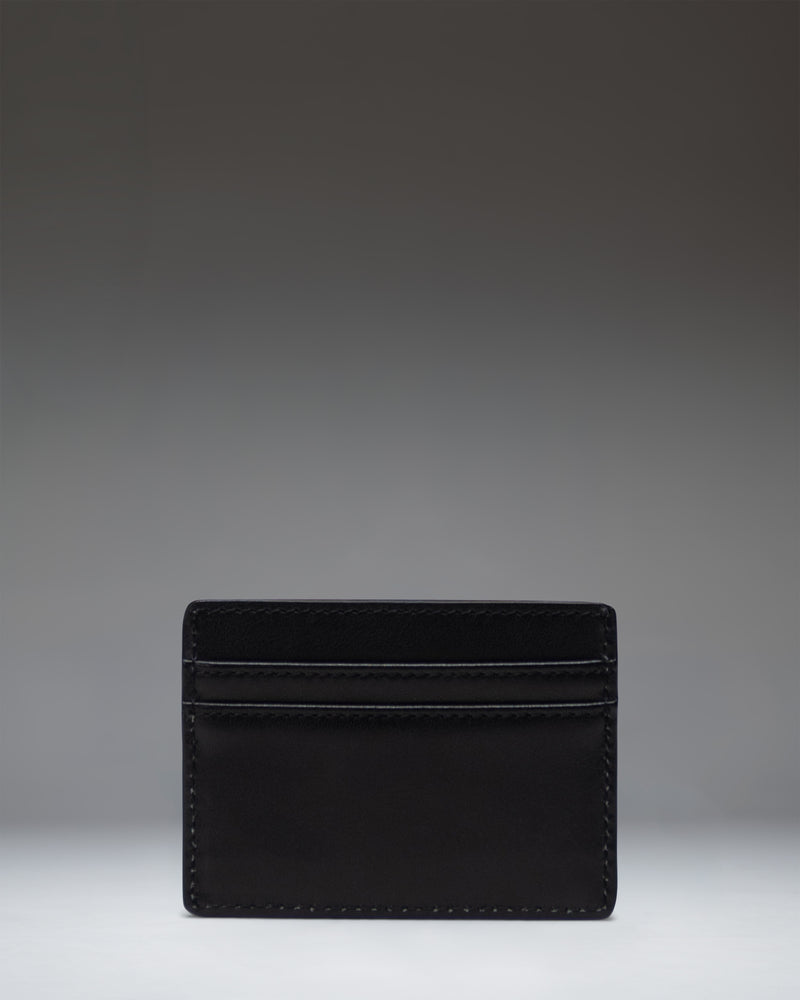 Herschel Supply Co Charlie Cardholder Leather in black. Minimalist wallet featuring multiple card slots and a top sleeve pocket.
