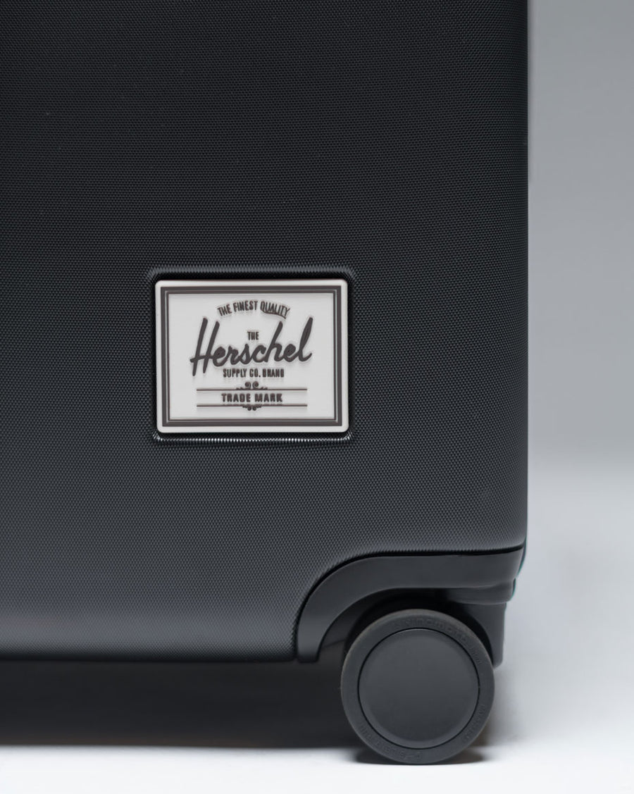 Herschel Heritage Hardshell Large Luggage shown in a lineup of all available color options.