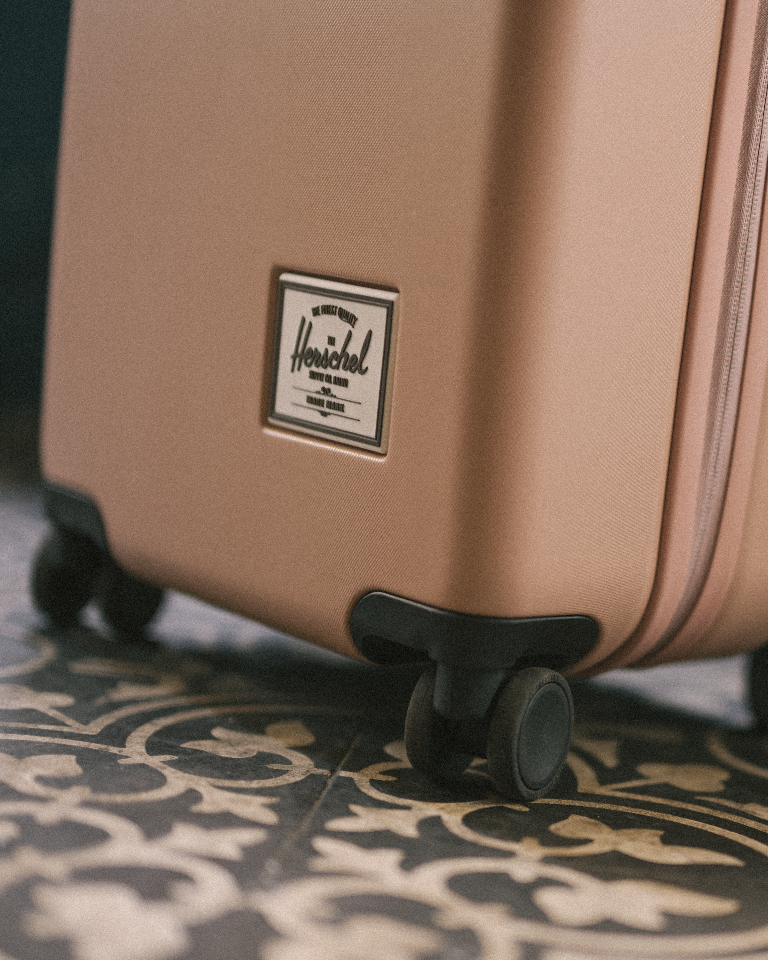 Herschel Heritage Hardshell Large Luggage highlighting its durable exterior design and functional features.