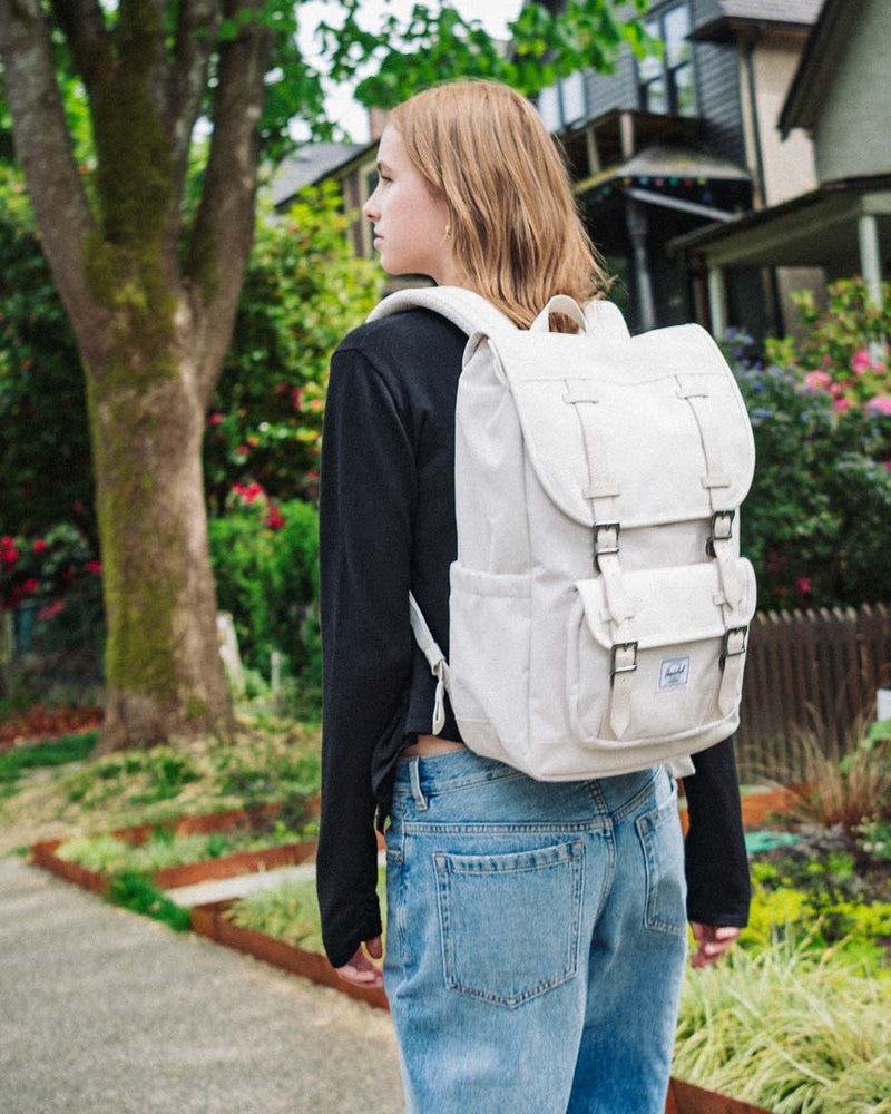 herschel america backpack size Little Mid-Volume Herschel Supply Co. USA shaped pull and is protected by a top flap equipped with magnetic closure straps and metal buckles Herschel Little America Backpack Mid-Volume