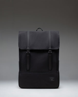 Herschel Survey Backpack in Black Tonal, showing the front view of the minimalist bag with dual straps.