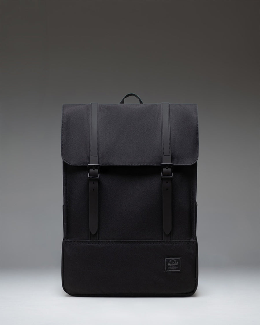 Herschel Survey Backpack in Black Tonal, showing the front view of the minimalist bag with dual straps.