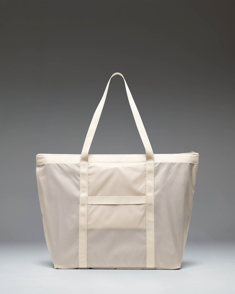 Herschel Supply Co. Portland Packable Tote in Moonbeam Tonal, showing the lightweight travel bag unfolded and ready for use.