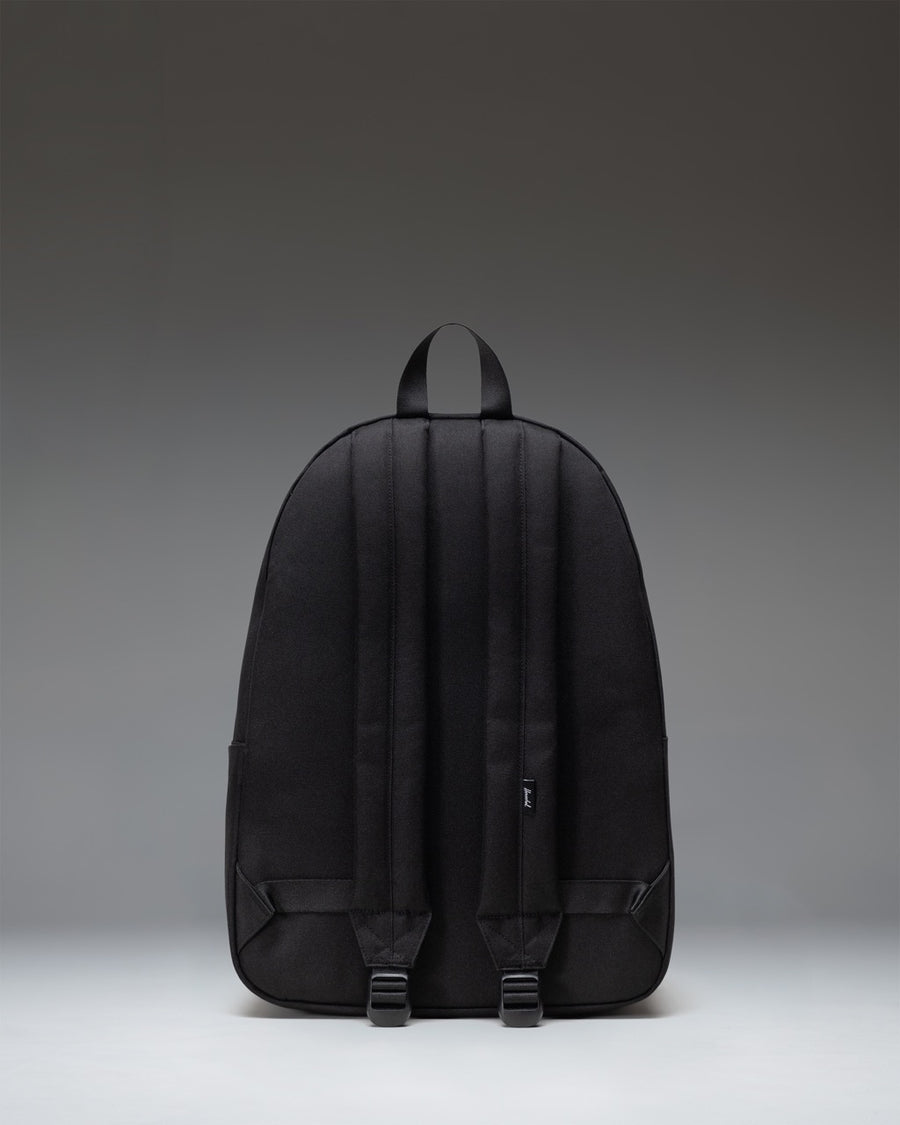 Herschel Classic XL Backpack in Black, featuring a spacious main compartment, front storage pocket, and classic woven label.