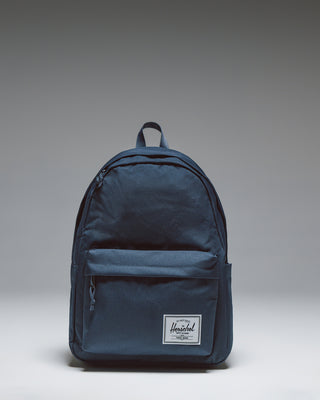 Herschel Classic XL Backpack in navy blue, shown from a front angle against a white background.
