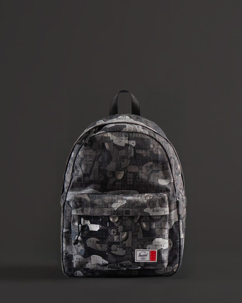 Herschel Supply Co. LEGO Classic Backpack in Abstract Bricks Black featuring a black body with a subtle tonal geometric brick pattern.