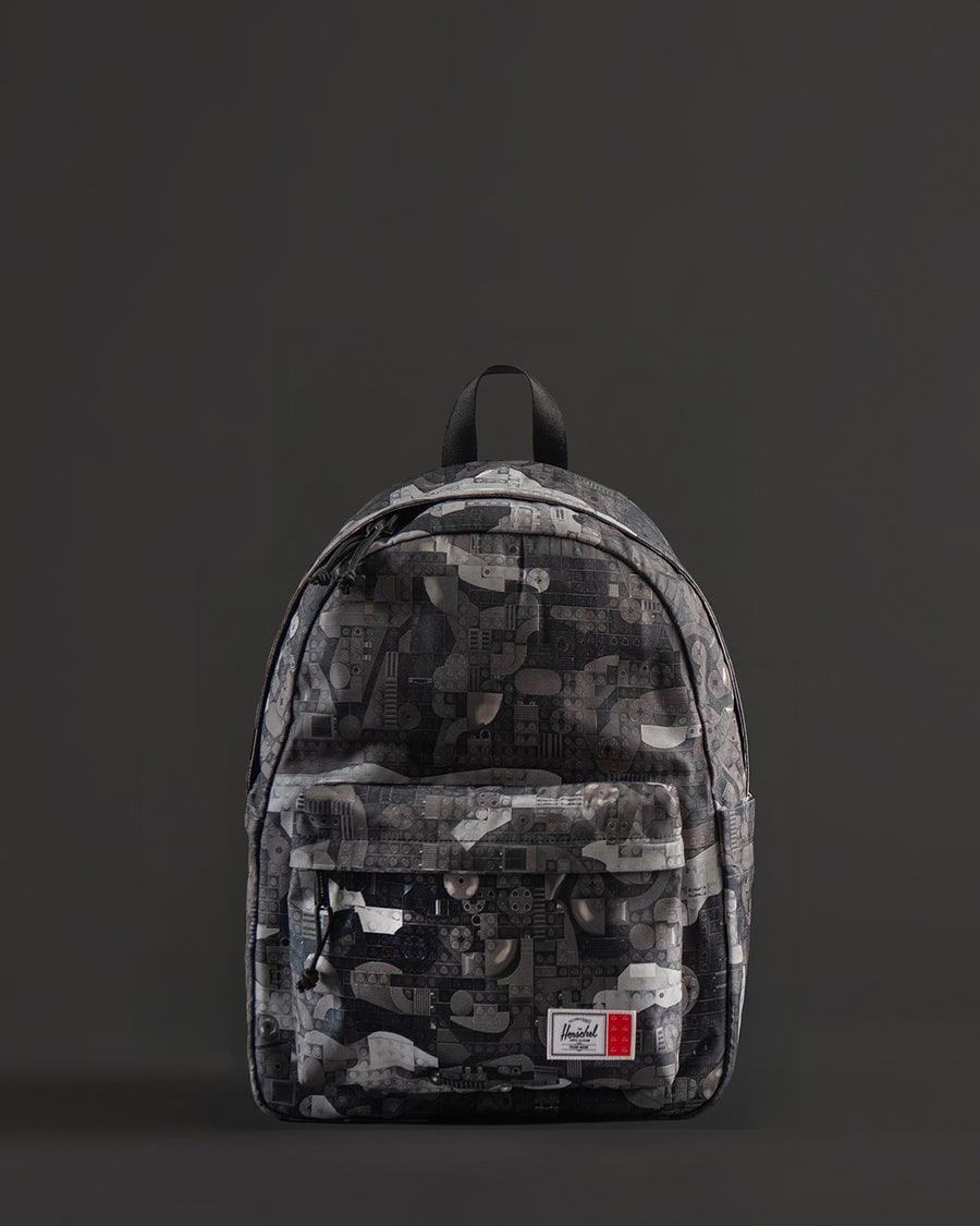 Herschel Supply Co. LEGO Classic Backpack in Abstract Bricks Black featuring a black body with a subtle tonal geometric brick pattern.
