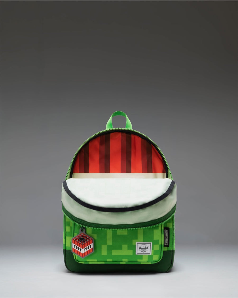 Herschel Supply Co. Minecraft Heritage Kids Backpack in the green and black pixelated Creeper pattern.