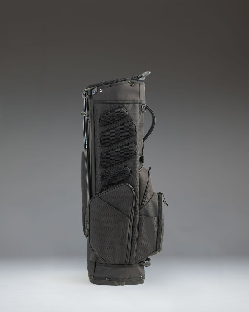 Black Herschel Watt Stand Bag golf bag featuring durable stand legs and comfortable carrying straps.