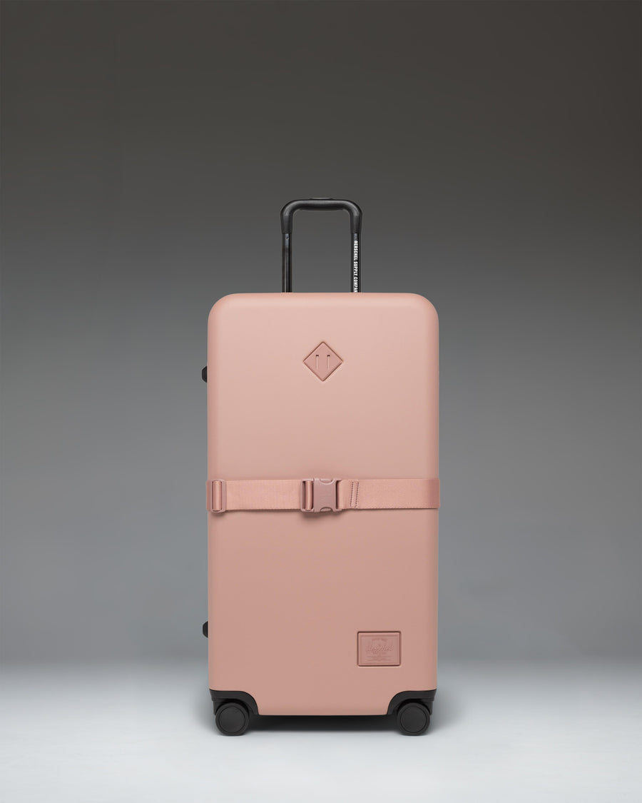 Herschel Heritage Hardshell Large Luggage Exp in Ash Rose, showing a durable pink hardside suitcase.