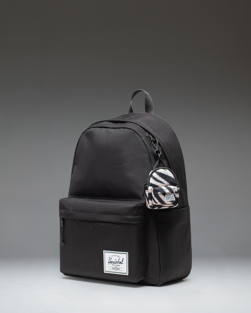 Herschel Classic Backpack Bag Charm in Zebra stripe pattern.