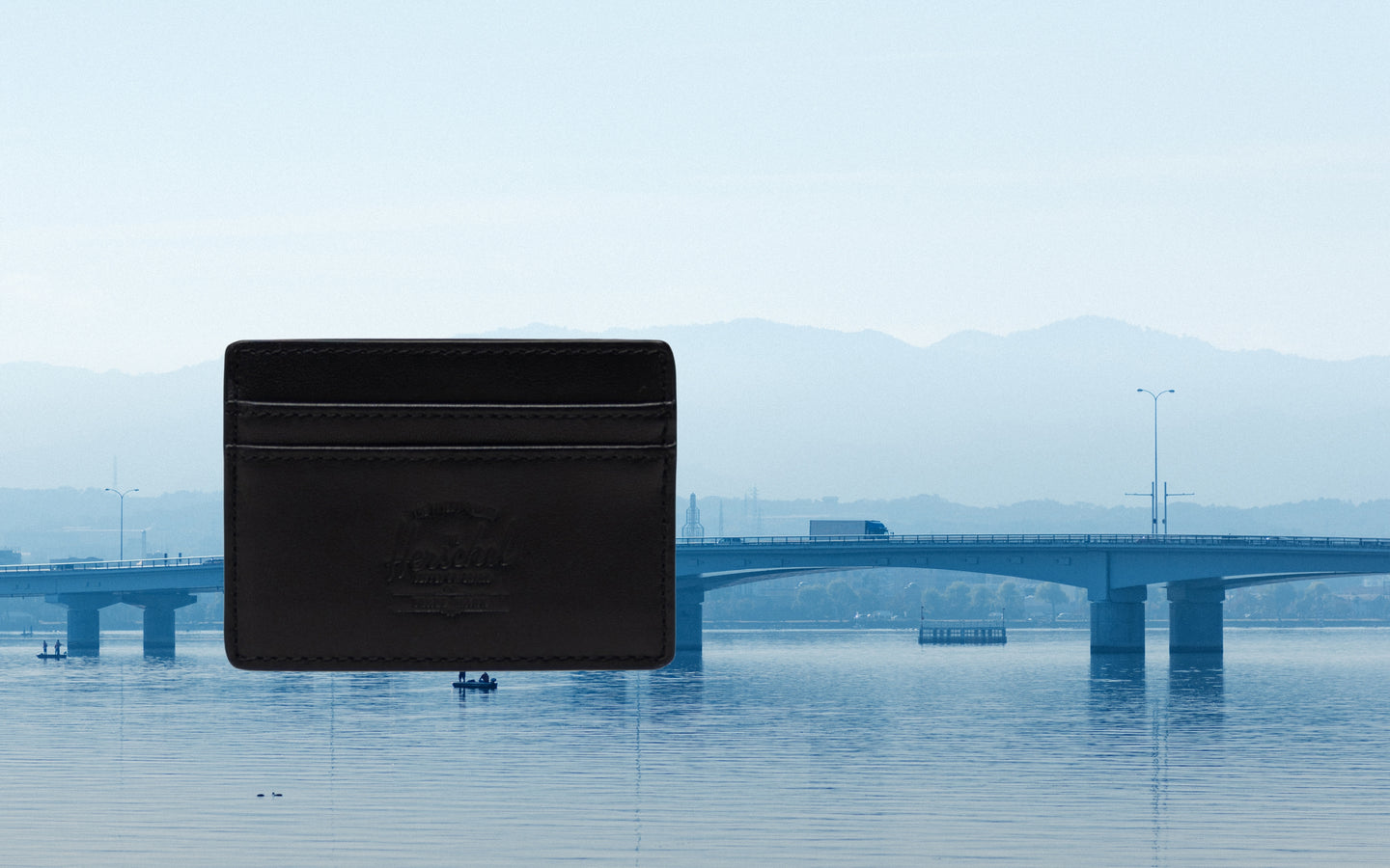Black Herschel Supply Co. Charlie Cardholder Leather wallet displaying a classic, minimalist design.
