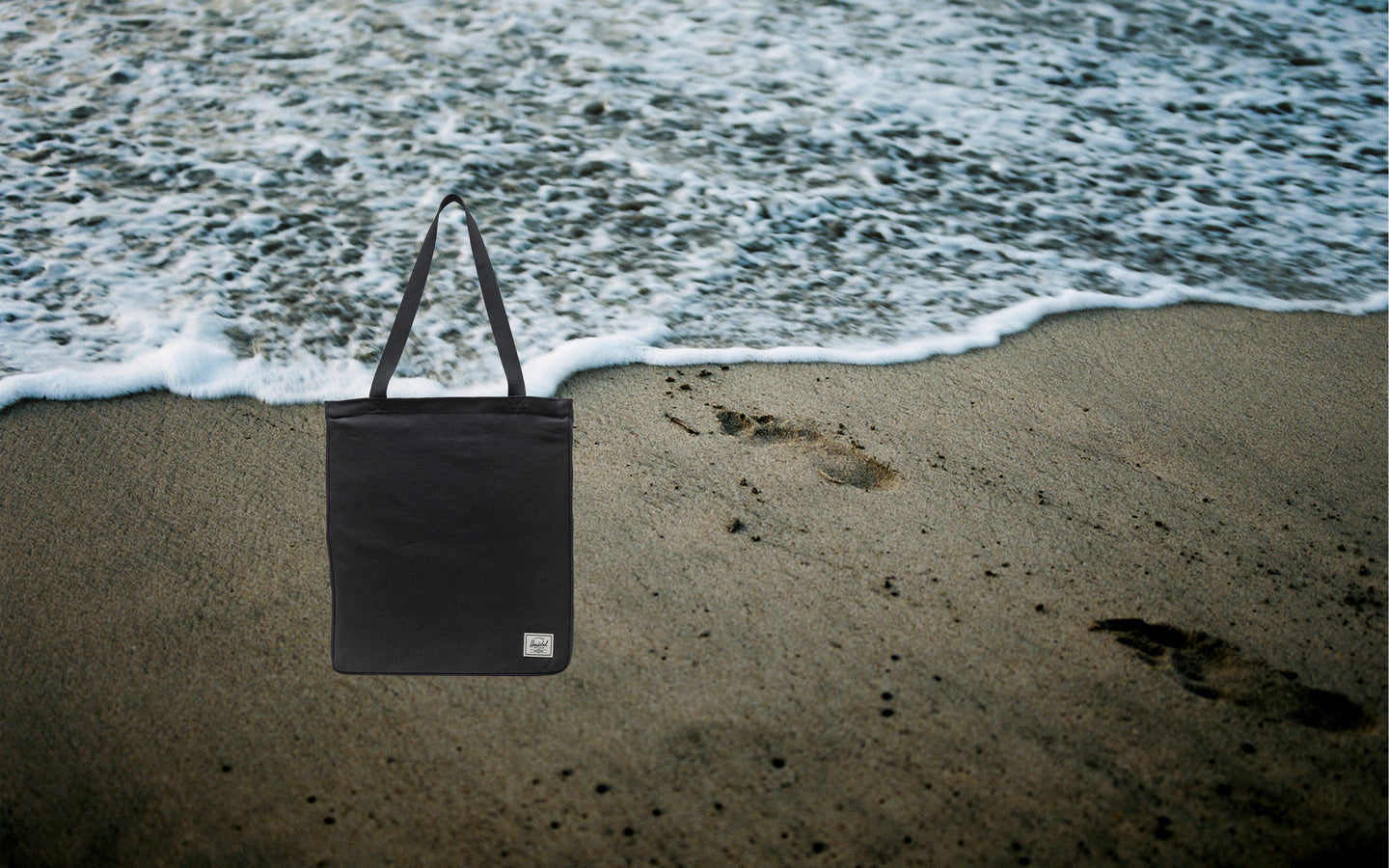 Herschel Supply Co. Inga Tote in black, shown on a clean background.