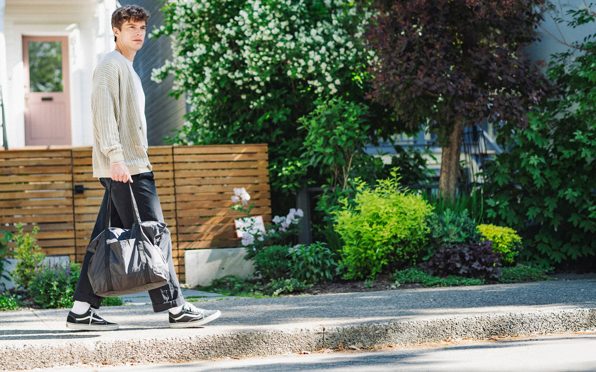 Herschel Supply Co. Portland Packable Tote in Black Tonal, shown expanded as a lightweight, everyday tote bag.