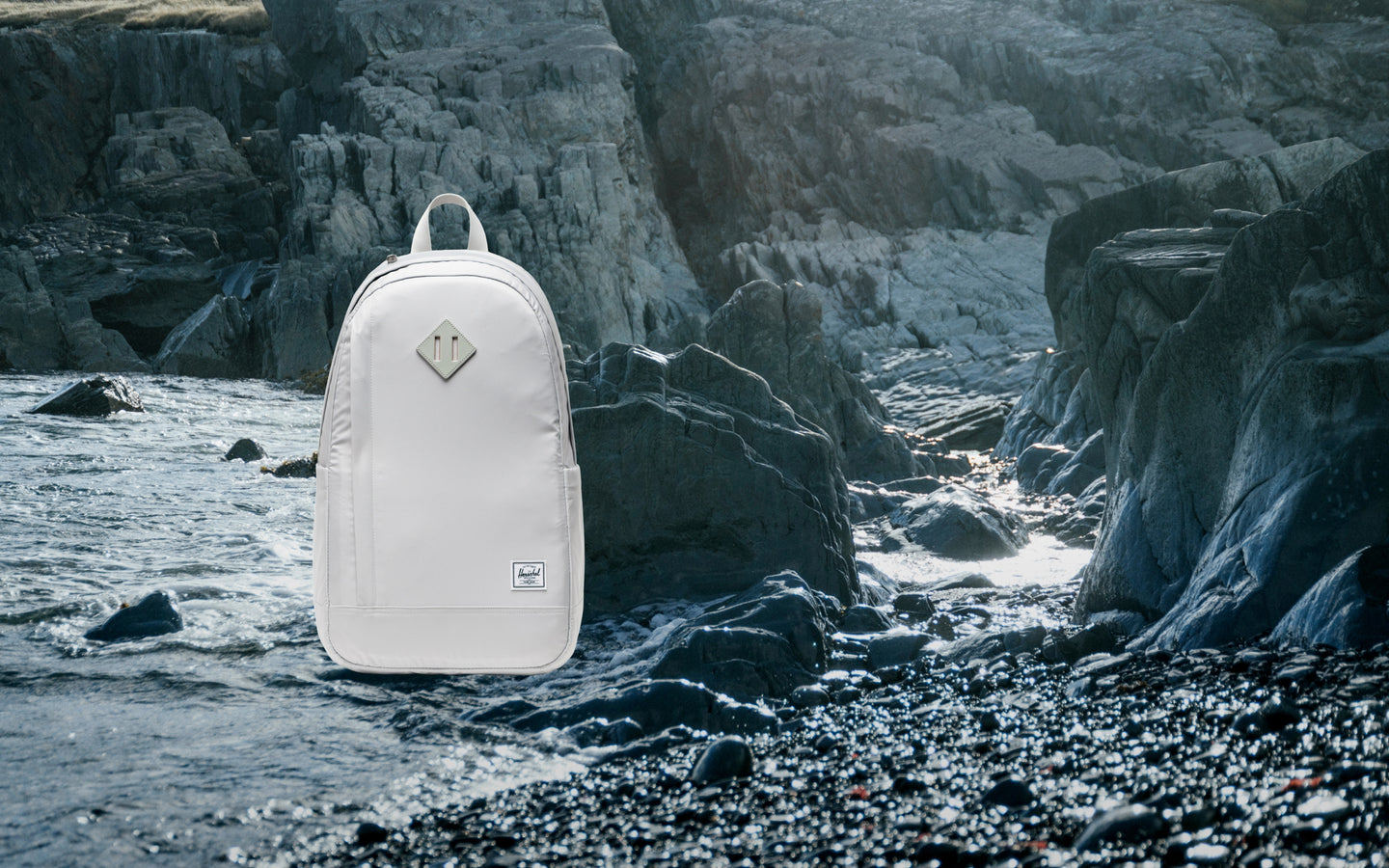 Herschel Seymour Backpack in Metal grey, shown on a desktop background as a hero image.