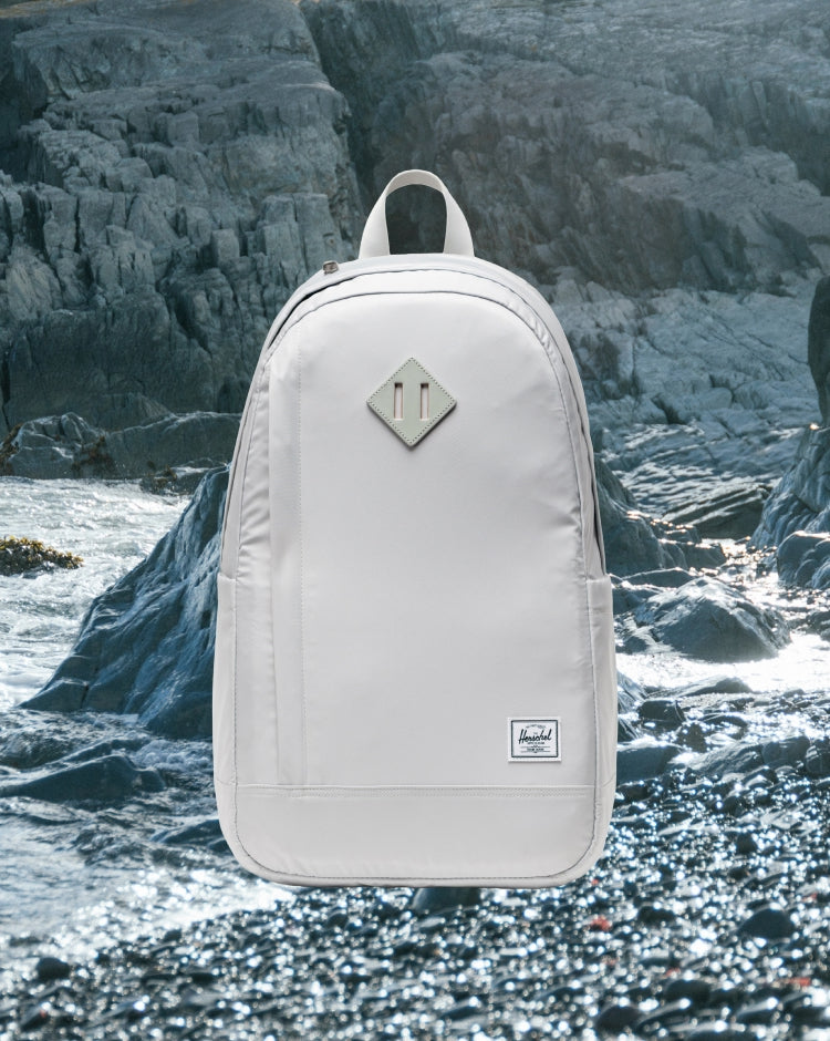 Herschel Supply Co. Seymour Backpack in Metal. Front view of the grey, durable commuter backpack with dual water bottle pockets.