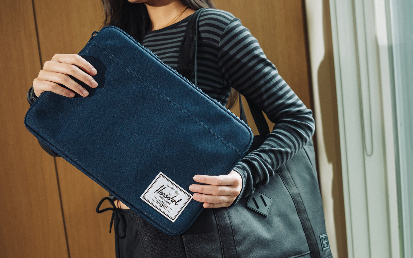 Herschel Supply Co. Anchor 14 Inch Sleeve in Navy Blue shown from a clean front perspective against a white background.