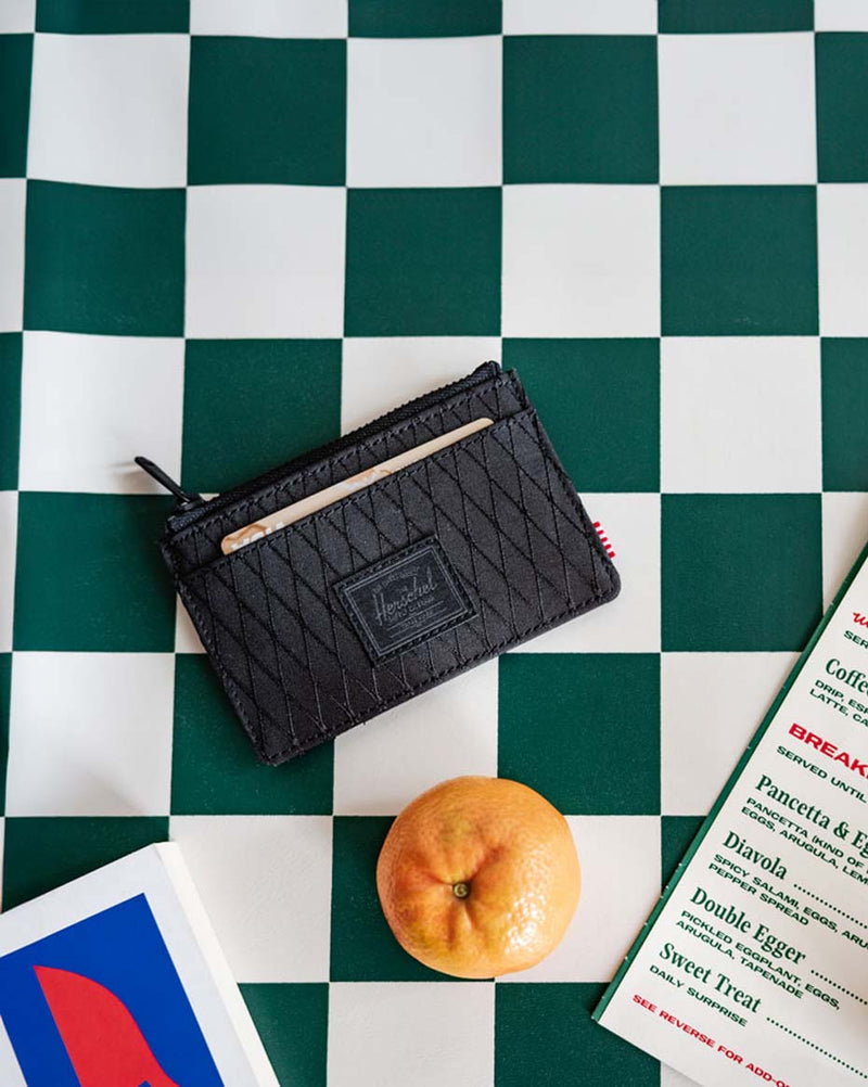 Herschel Supply Co. Oscar Cardholder in Black Diamond/Black, showcasing its compact design and multiple card slots.