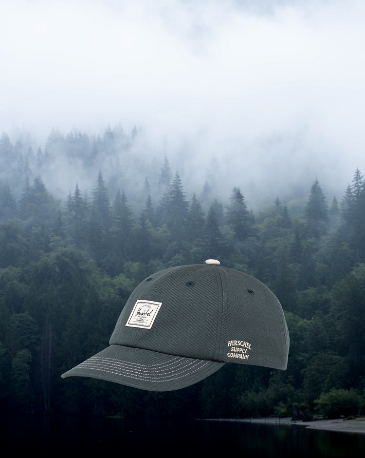 Herschel Supply Co. Sylas Premium Cap in Green Gables with vintage white stitching, displayed from the front.