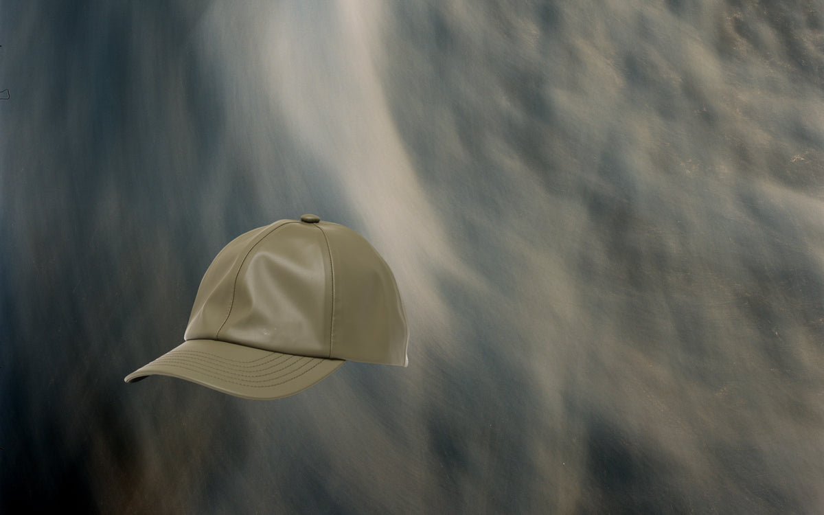 Herschel Supply Co Sylas Rain Cap in Ivy Green, shown from a desktop hero shot perspective.