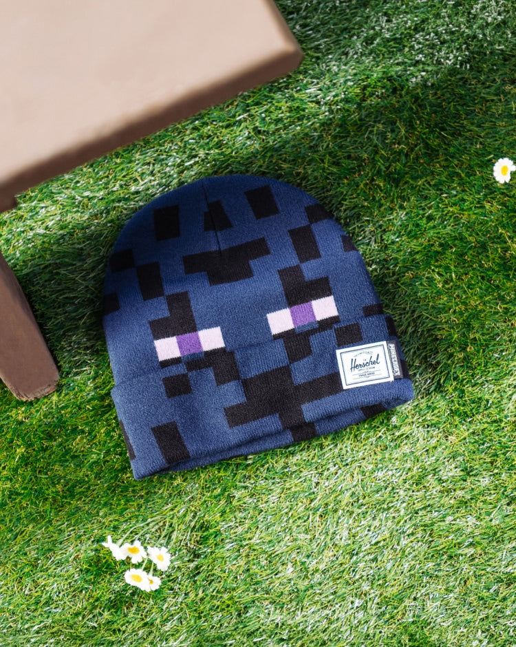 Herschel Supply Co. Kids Minecraft Elmer Beanie in Enderman black featuring a classic cuffed knit design and a Minecraft logo patch.