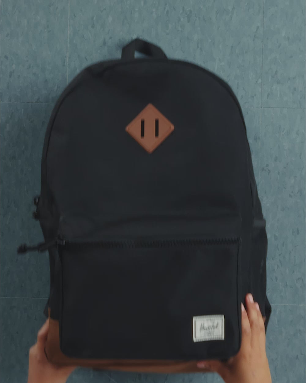 Herschel Heritage Youth Backpack size guide chart. Dimensions: 17 inches high, 12 inches wide, and 6 inches deep. Floating laptop sleeve fits a 13 or 14 inch laptop.